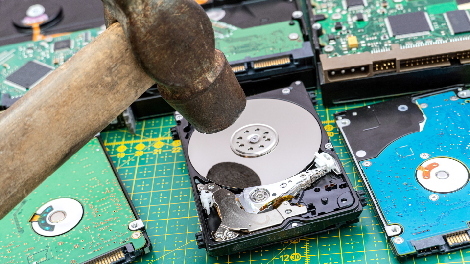 Destruction, deleting of data, information on a hard disk drive with hammer