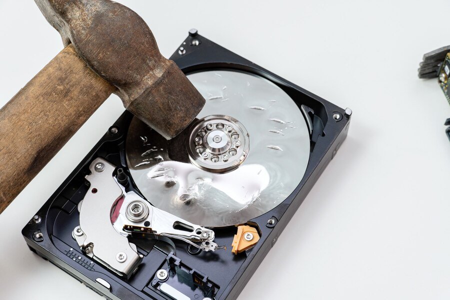 destruction-deleting-data-information-hard-disk-drive-with-hammer_157402-2924